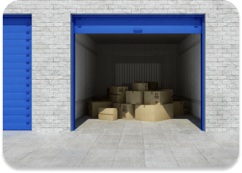 An open self-storage unit with a blue door and cardboard boxes inside.